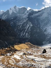 Scenic view of snowcapped mountains against sky