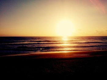 Scenic view of sea at sunset