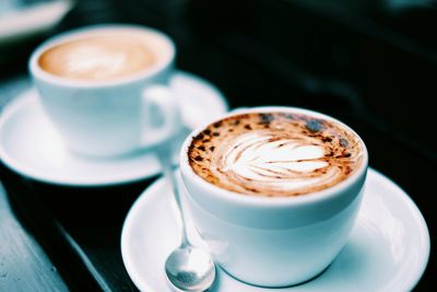 Close-up of cappuccino on table