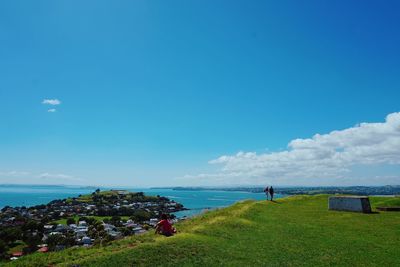 Scenic view of sea against blue sky