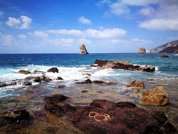 Scenic view of beach against sky