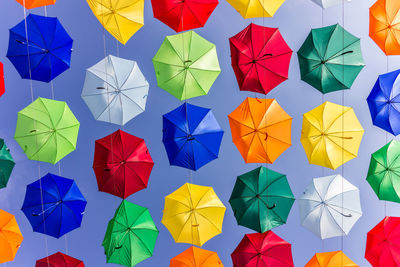 High angle view of multi colored umbrellas on paper