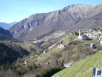 Scenic view of landscape and mountains against sky
