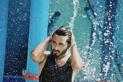 Portrait of young man in swimming pool