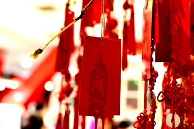 Close-up of red bell hanging in temple