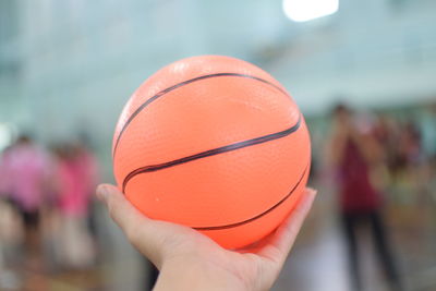 Close-up of hand holding ball