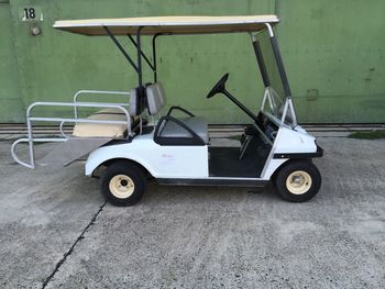 Side view of a car parked against wall