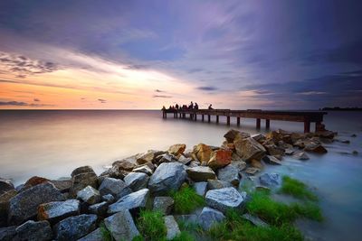 Scenic view of sea against sky at sunset