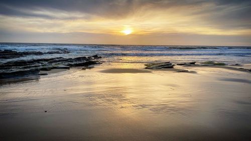 Scenic view of sea against sky during sunset