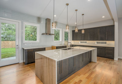 New kitchen island and countertops have been installed during a kitchen renovation