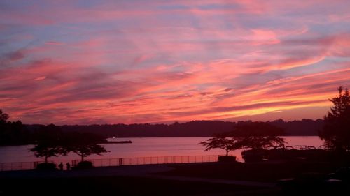 Scenic view of lake at sunset