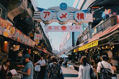 People on street market in city