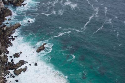 High angle view of rocks in sea