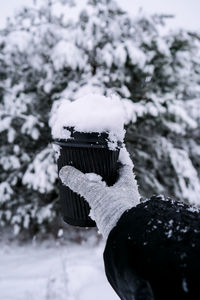 Rear view of woman standing on snow