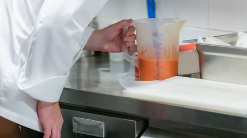 Chief checking mixed ingredients in the restaurant.