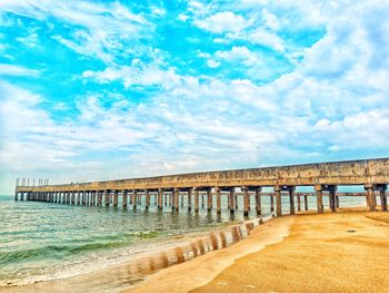 Pier over sea against sky