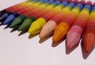 High angle view of crayons on gray background