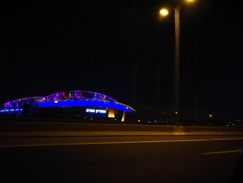 Illuminated light against sky at night