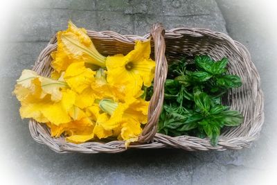 High angle view of yellow flower on table