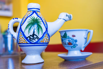 Close-up of teapot on table