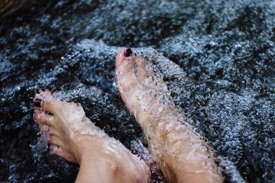 Low section of woman in water