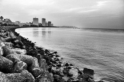 View of sea with buildings in background