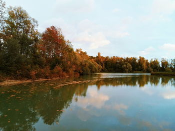 Reflection of trees in lake against sky during autumn