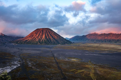 View of volcanic landscape against sky