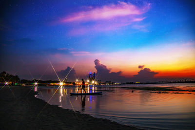 Scenic view of sea against sky at night