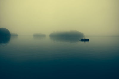 Diving platform in lake during foggy weather