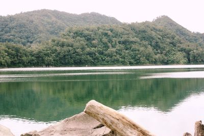 Scenic view of lake with mountains in background