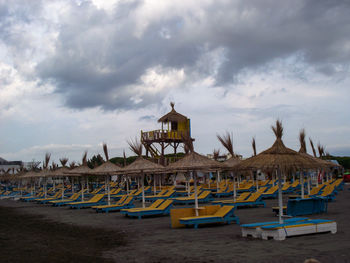 Built structure on beach against sky