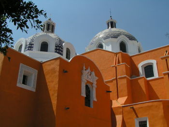 Low angle view of bell tower against sky