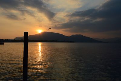 Scenic view of lake against sky during sunset