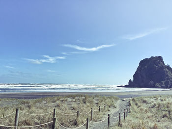 View of beach against cloudy sky