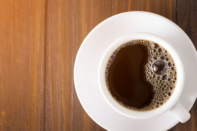 High angle view of coffee cup on table