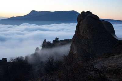 Rock formations on mountain against sky