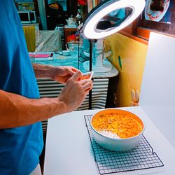 Midsection of man preparing food