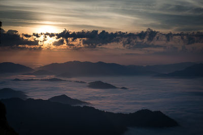 Scenic view of silhouette mountains against sky during sunset