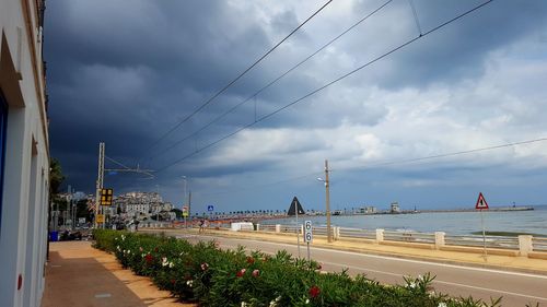 Panoramic shot of cityscape against dramatic sky