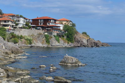 View of sea with buildings in background