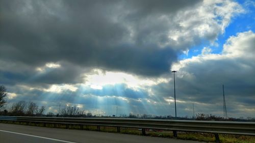 Road against cloudy sky