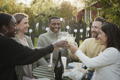 Happy friends having party in garden