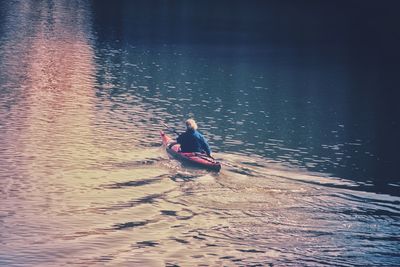 High angle view of man on boat in sea