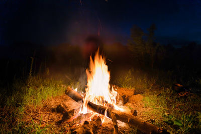 High angle close up of kettle over camp fire in a forest. stock photo