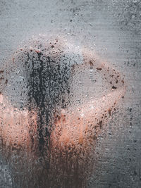 Full frame shot of raindrops on glass window