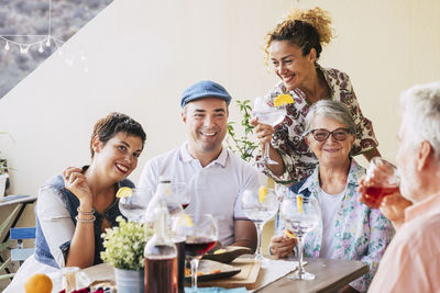 Cheerful family having food home 