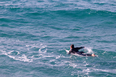 High angle view of swimming in sea