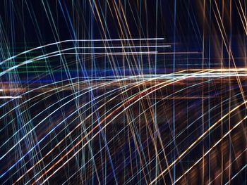 Full frame shot of light trails against sky at night