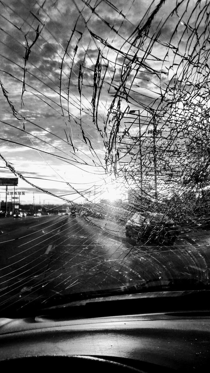 ROAD SEEN THROUGH CAR WINDSHIELD